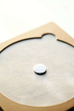 Detail of a DVD case, on wood.の写真素材