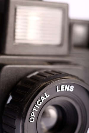 An old film plastic camera isolated on white.