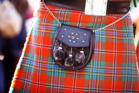 Color detail of a traditional Scottish kilt, with a bag.の写真素材