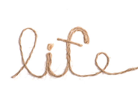 The word "life" written with rope, on white.の写真素材