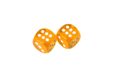 Two yellow dices displaying "six" isolated on whiteの写真素材