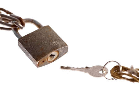 A padlock and a key, isolated on white.