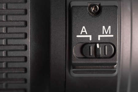 Detail of the auto focus switch on a photo lenses