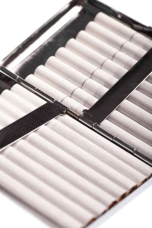 Color detail of a cigarette case with white cigarettes.の写真素材
