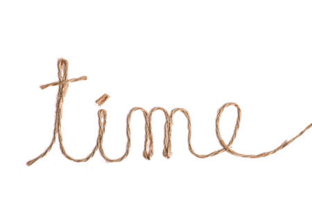 The word "time" written with rope, on whiteの写真素材