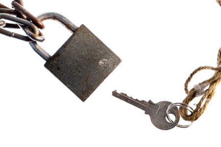 A padlock and a key, isolated on white.の写真素材