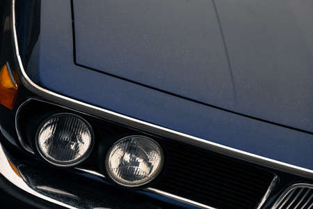 Color detail on the headlight of a car.