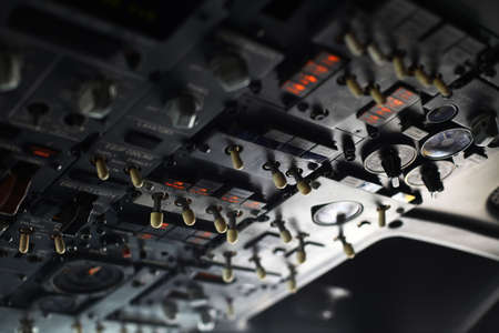 The pilots' control panel inside a passenger airplane.の写真素材