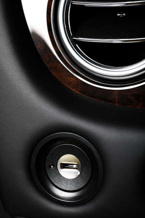 Close up shot of the ignition keyhole in a car.