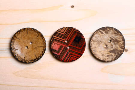 Close up color shot of some wooden buttons.