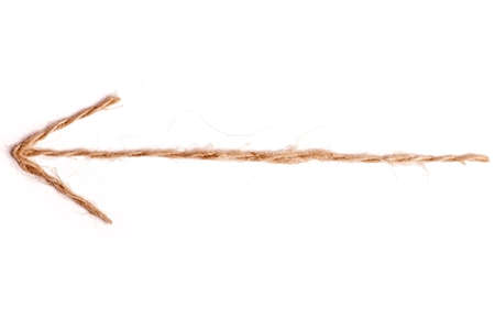 An arrow made from rope, isolated on white, pointing backwards.の写真素材