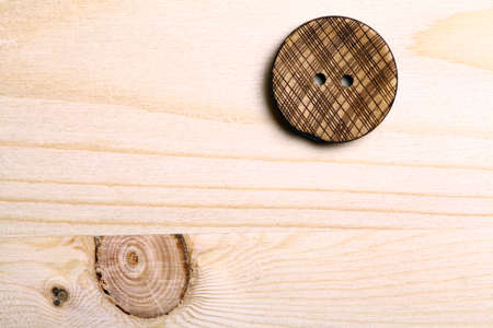 Close up color shot of a wooden button.の写真素材