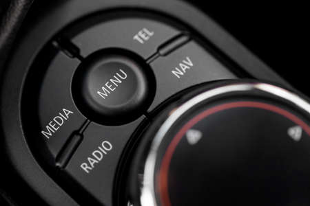 Detail of some black buttons in a car.