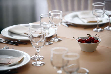 Shot with a dinner table with cherries in a restaurant.の写真素材