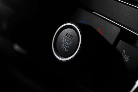 Color detail with the air conditioning button inside a car.の写真素材