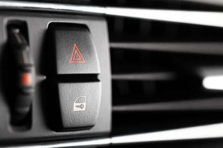 Detail of a warning button in a car.