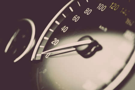 Close up shot of a speedometer in a car.