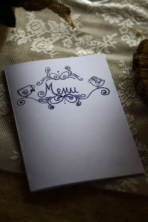 Close up shot of a menu on a table.の写真素材