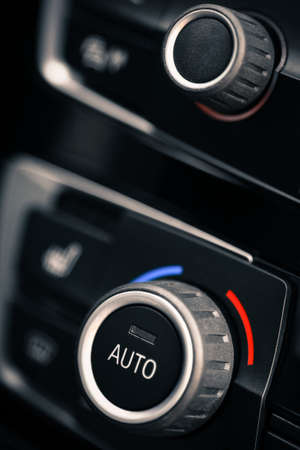 Color detail with the air conditioning button inside a car.の写真素材