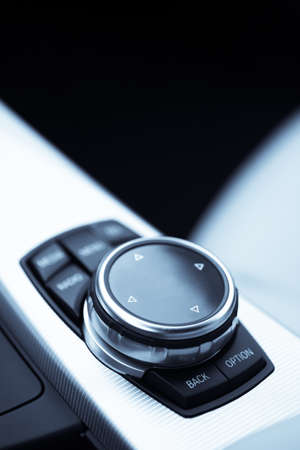 Detail of some black buttons in a car.