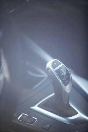 Detail on a automatic gear shifter in a new car.