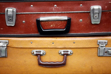 Color shot of a pile of old, used suitcases.の写真素材