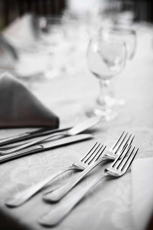 Shot with some forks on a table in a restaurant.の写真素材