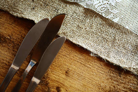Shot with some knives on a table in a restaurant.の写真素材