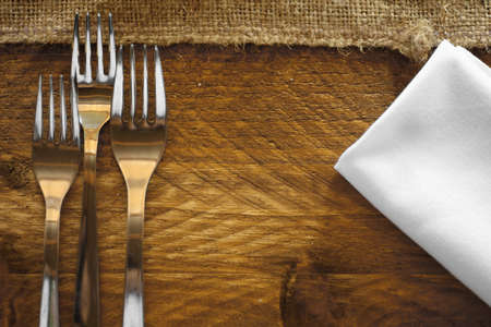 Shot with some forks on a table in a restaurant.の写真素材