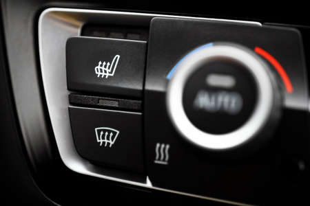 Detail of the heated seats button in a car.の写真素材
