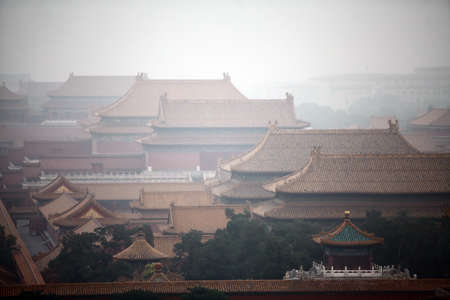 High angle horizontal shot of the Forbidden City in Beijing,  China, on a foggy day.のeditorial素材