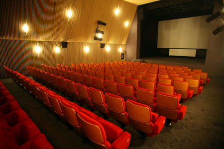 Color horizontal shot of some seats in a cinema hall.のeditorial素材