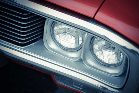 Color detail on the headlight of a vintage carの写真素材