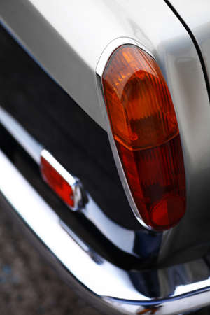 Detail on the rear light of a vintage car.の写真素材