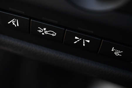 Detail shot of some black buttons inside a car.