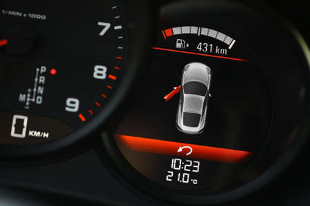 Color detail of an error message on a car's dashboard, indicating a door is opened.