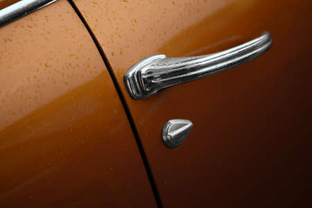 Color horizontal shot of a vintage car door handle.の写真素材