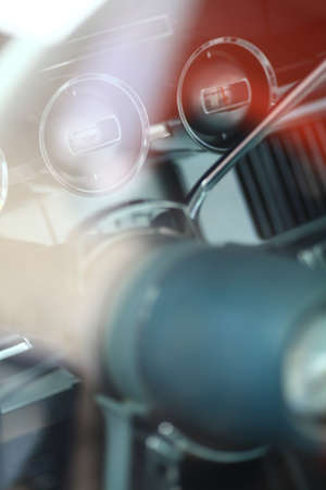 Color vertical shot of the dashboard of a vintage car.の写真素材