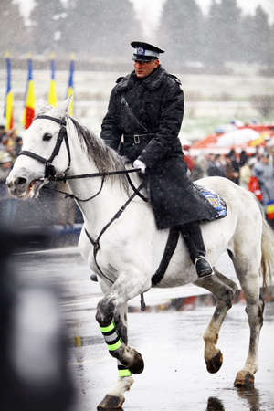 Bucharest, Romania - December 1, 2014: A mounted soldier rides a horse during celebrations for Romaniaのeditorial素材