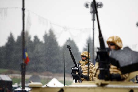 Bucharest, Romania - December 1, 2014: Soldiers ride in Humvees during celebrations for National Day...