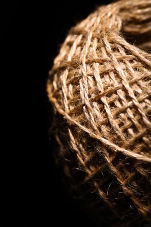 Color shot of a rope ball on black background.の写真素材