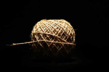 Color shot of a rope ball on black background.の写真素材