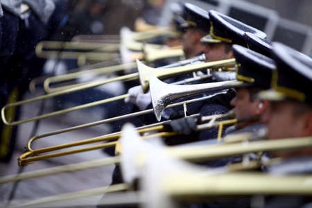 Bucharest, Romania - December 1, 2014: Orchestra musicians play the trombones during celebrations for National Day of Romania in Bucharest, Romania.のeditorial素材