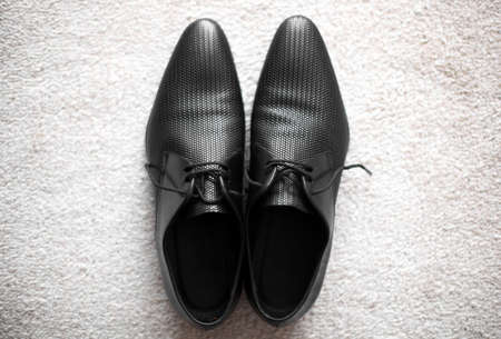Horizontal shot of a pair of black shoes.