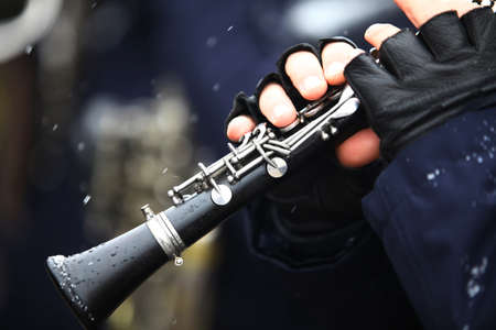 Color image of a clarinet being played on a snowy day.の写真素材