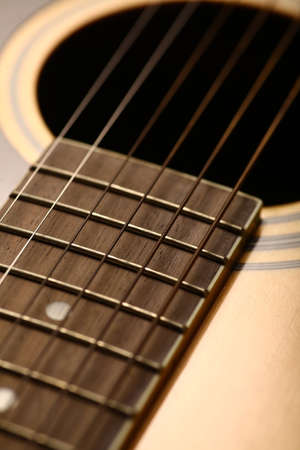 Color detail of an old, acoustic guitar.の写真素材