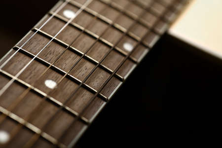 Color detail of an old, acoustic guitar.