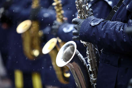 Color image of a saxophone being played on a snowy day.の写真素材