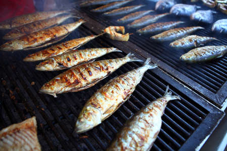 Color detail shot of some fish on a grill.の写真素材