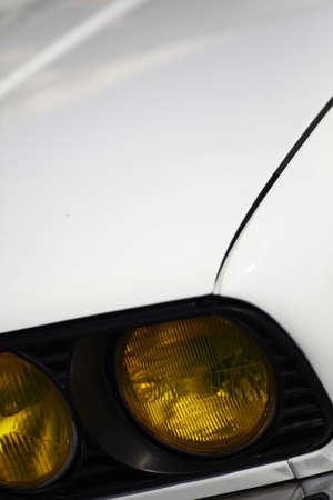 Color detail on the headlight of a vintage car.